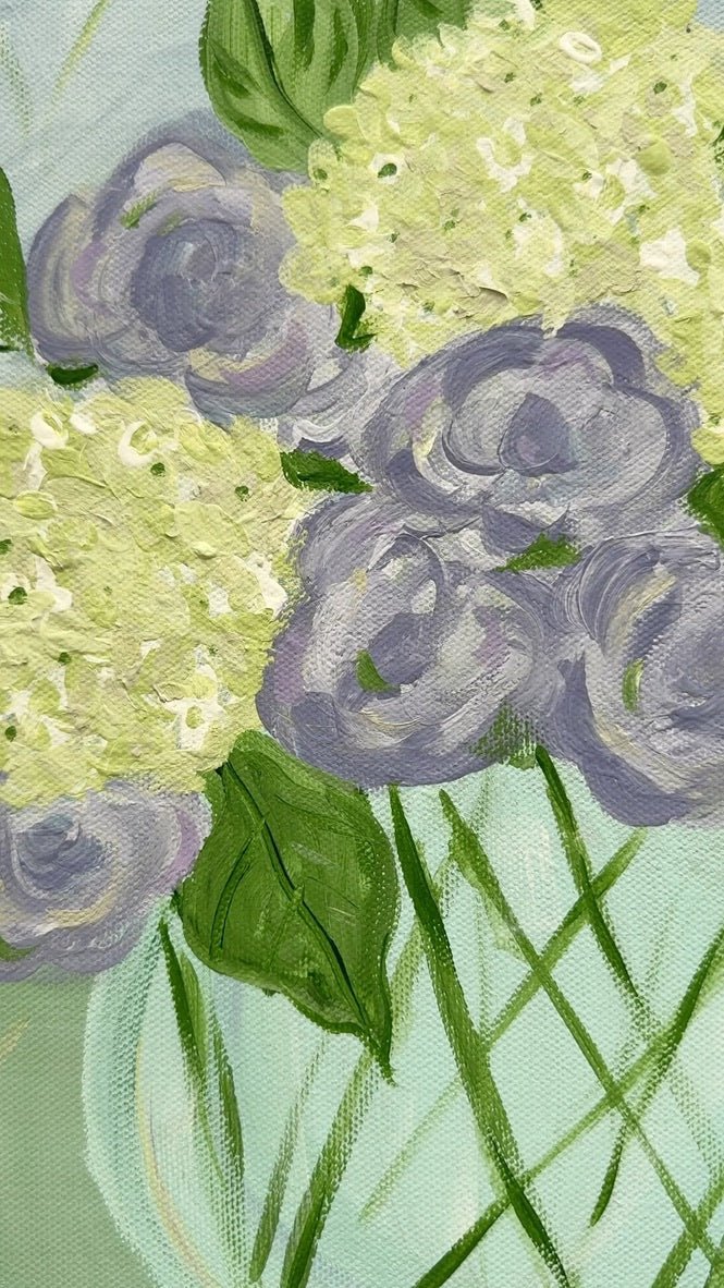 Purple and White Flowers in Blue Glass Vase
