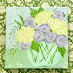 Purple and White Flowers in Blue Glass Vase