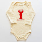 Beige baby onesie with red lobster graphic and 'Local Catch' text on a white background